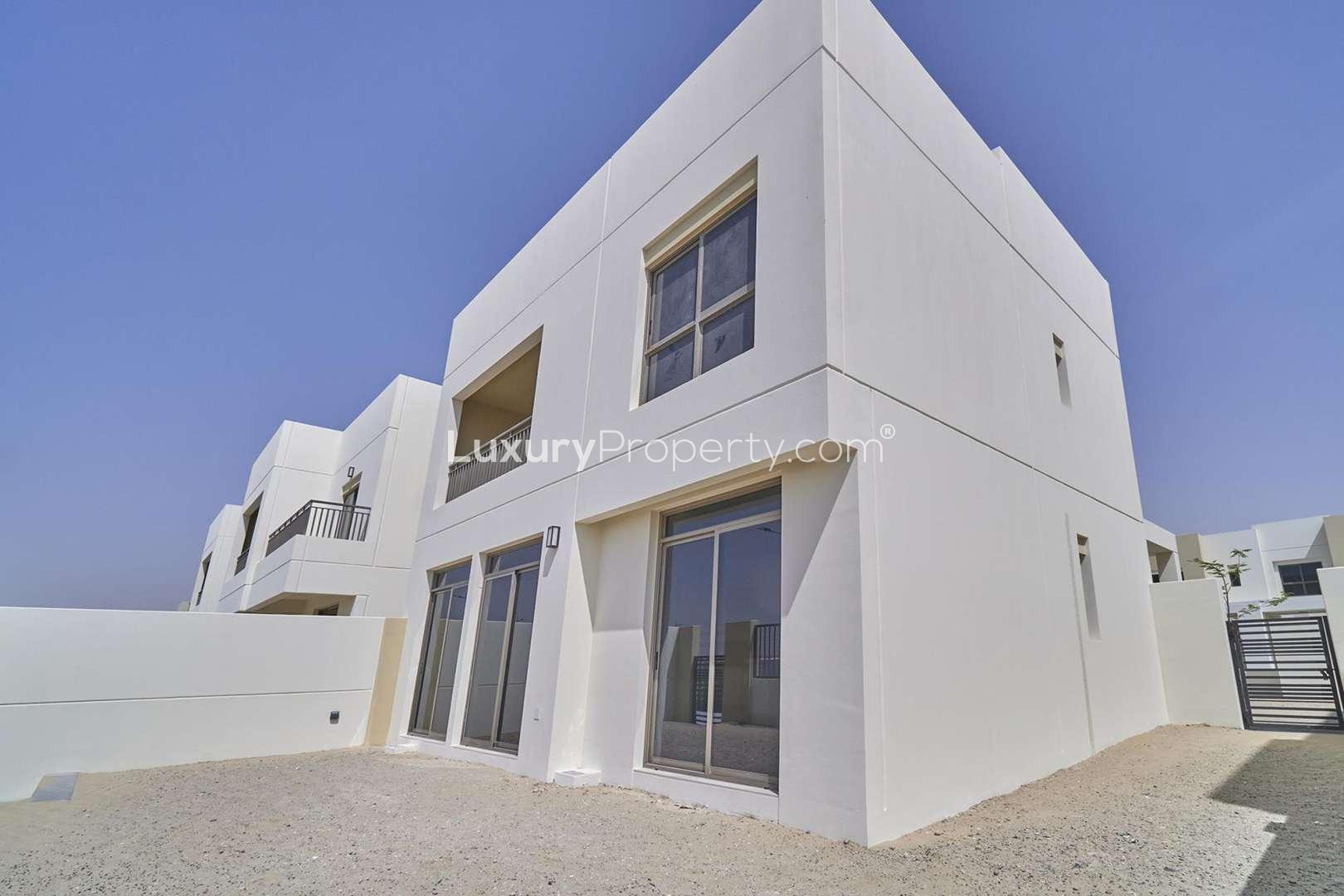 Elegant 4-bedroom townhouse exterior in Naseem Townhouses, Town Square, available for rent