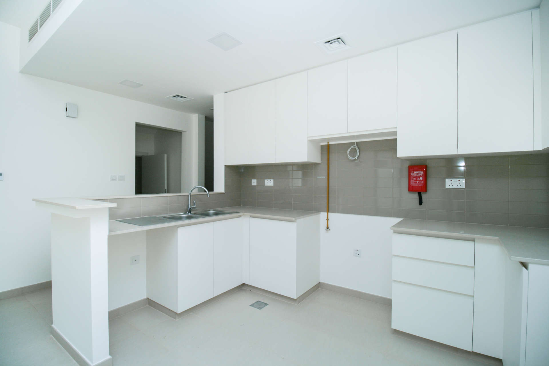 Exterior view of spacious 4-bedroom townhouse garden in Noor Townhouses, Town Square