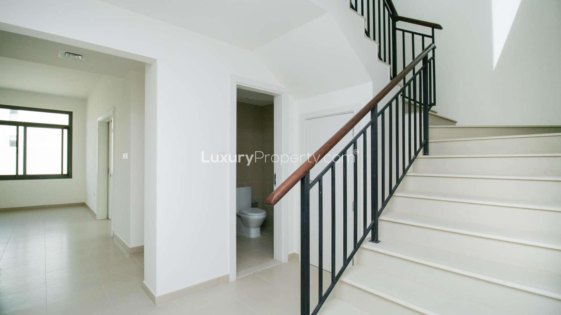 N/A,"Spacious stairway and hallway in Noor Townhouses, 4-bedroom rental property, Town Square.",Brand new modern kitchen in 4-bedroom townhouse, Noor, Town Square, available for rent