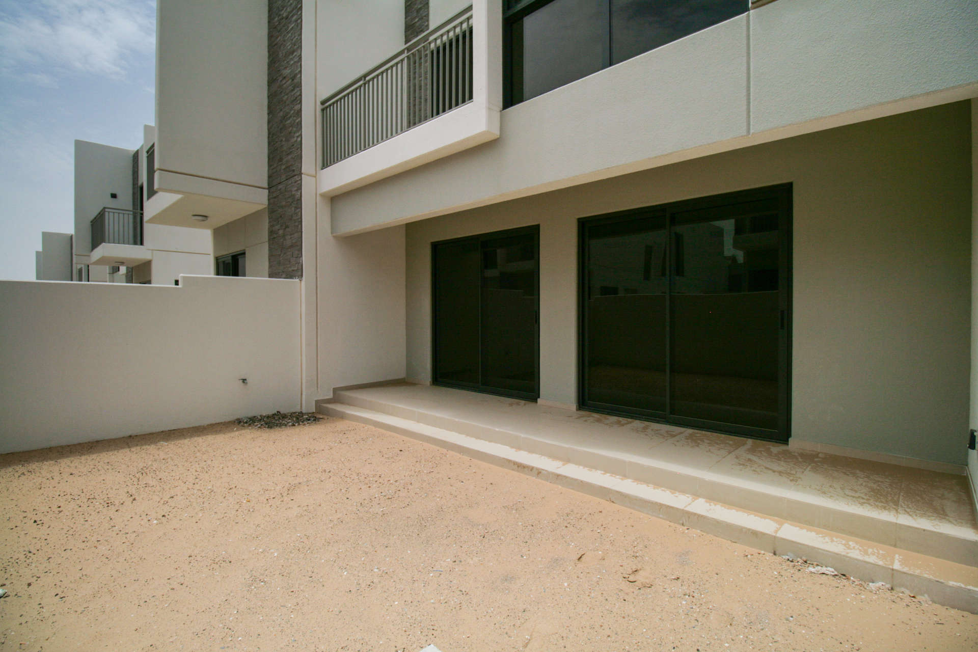 N/A,Single row townhouse backyard in Damac Hills 2, Primrose community, Akoya