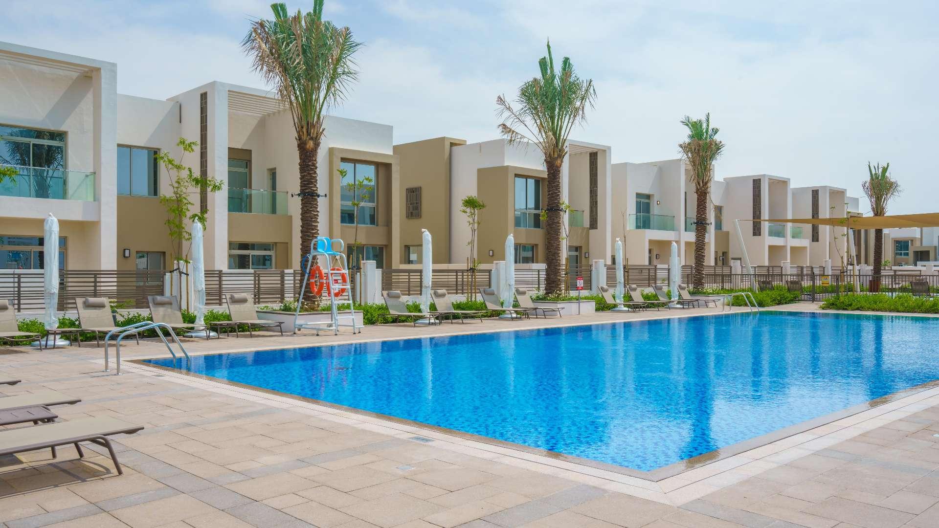 Elegant open-plan living area in Reem townhouse, Arabian Ranches 2, with modern decor