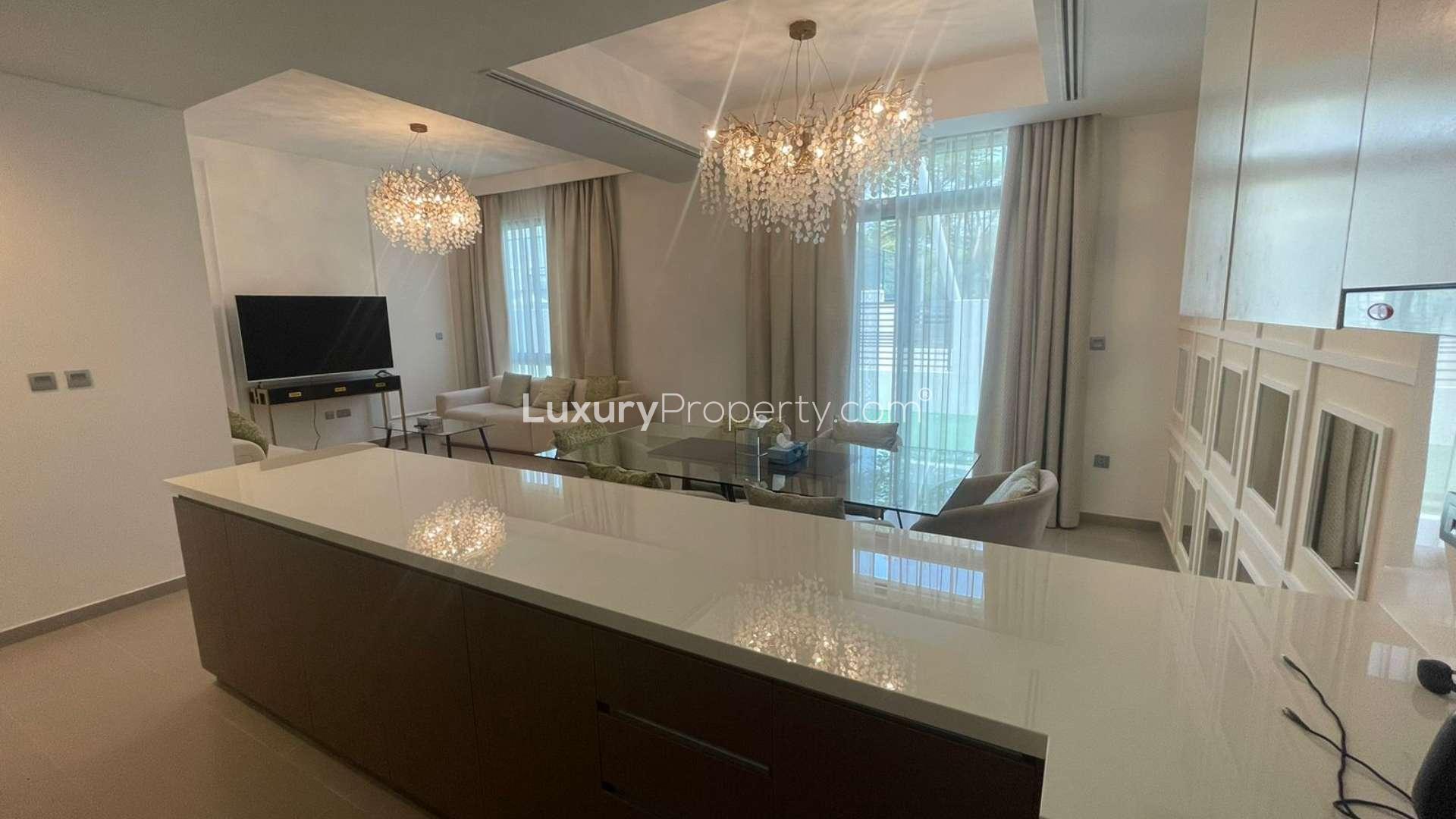 Elegant 4-bedroom townhouse exterior in Reem, Arabian Ranches 2, with green lawn view