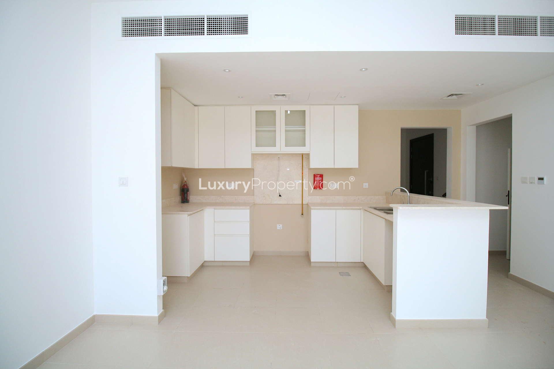 "Bright hallway in 4-bedroom townhouse for rent, Safi, Town Square, Dubai.",Modern kitchen in brand new 4-bedroom townhouse, Safi, Town Square, available for rent