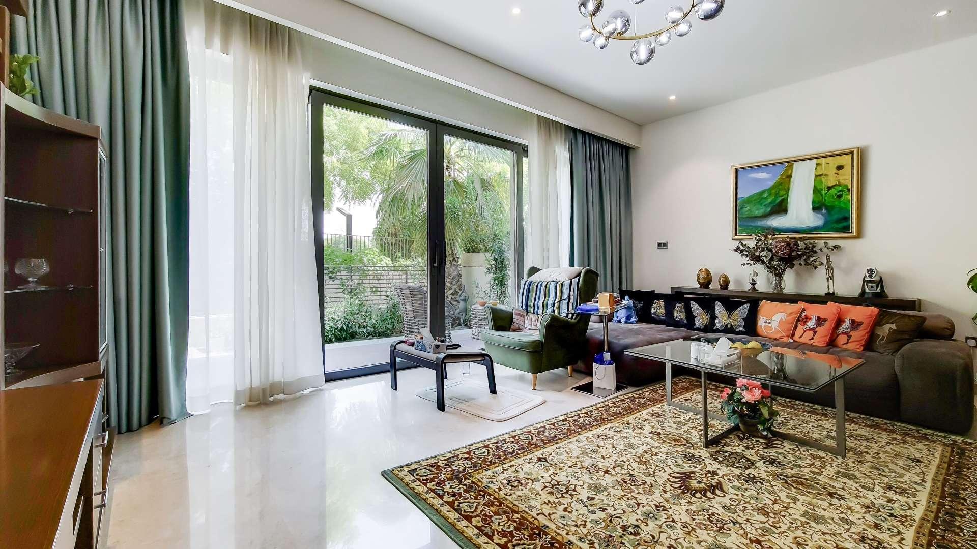 "Modern townhouse exterior with parking, Sobha Hartland, Mohammed Bin Rashid City, available for rent.",Luxury furnished living room in Sobha Hartland townhouse, Mohammed Bin Rashid City