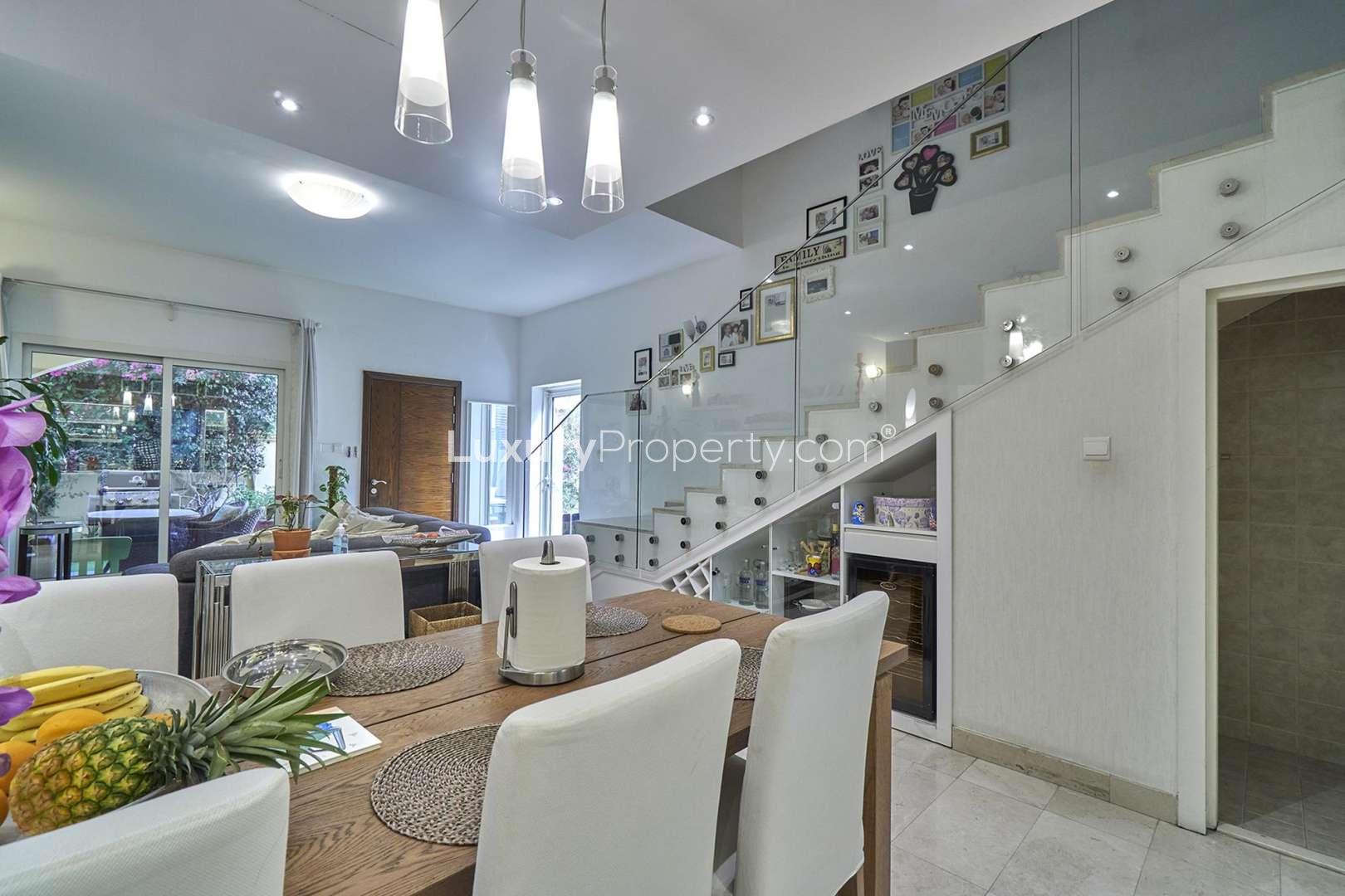 Outdoor patio with seating and BBQ in Valencia Park townhouse, Jumeirah Village Circle