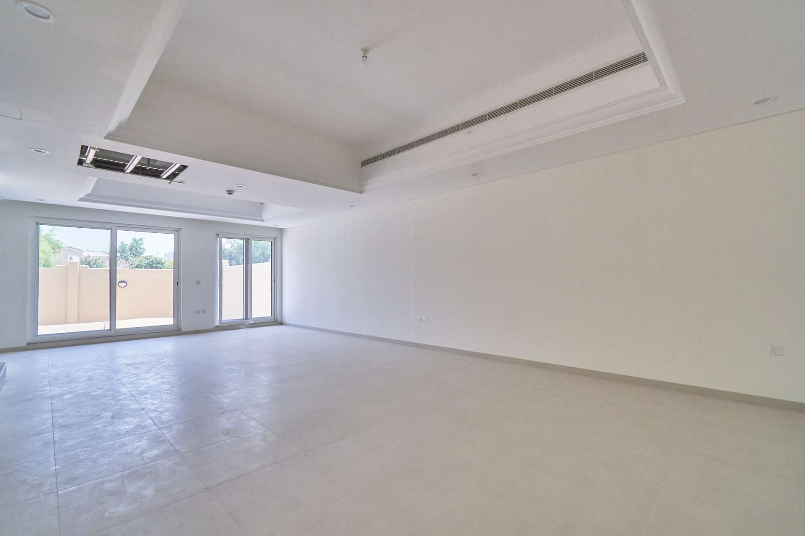 N/A,Spacious living room in Marbella Village townhouse, Victory Heights, Dubai Sports City for rent