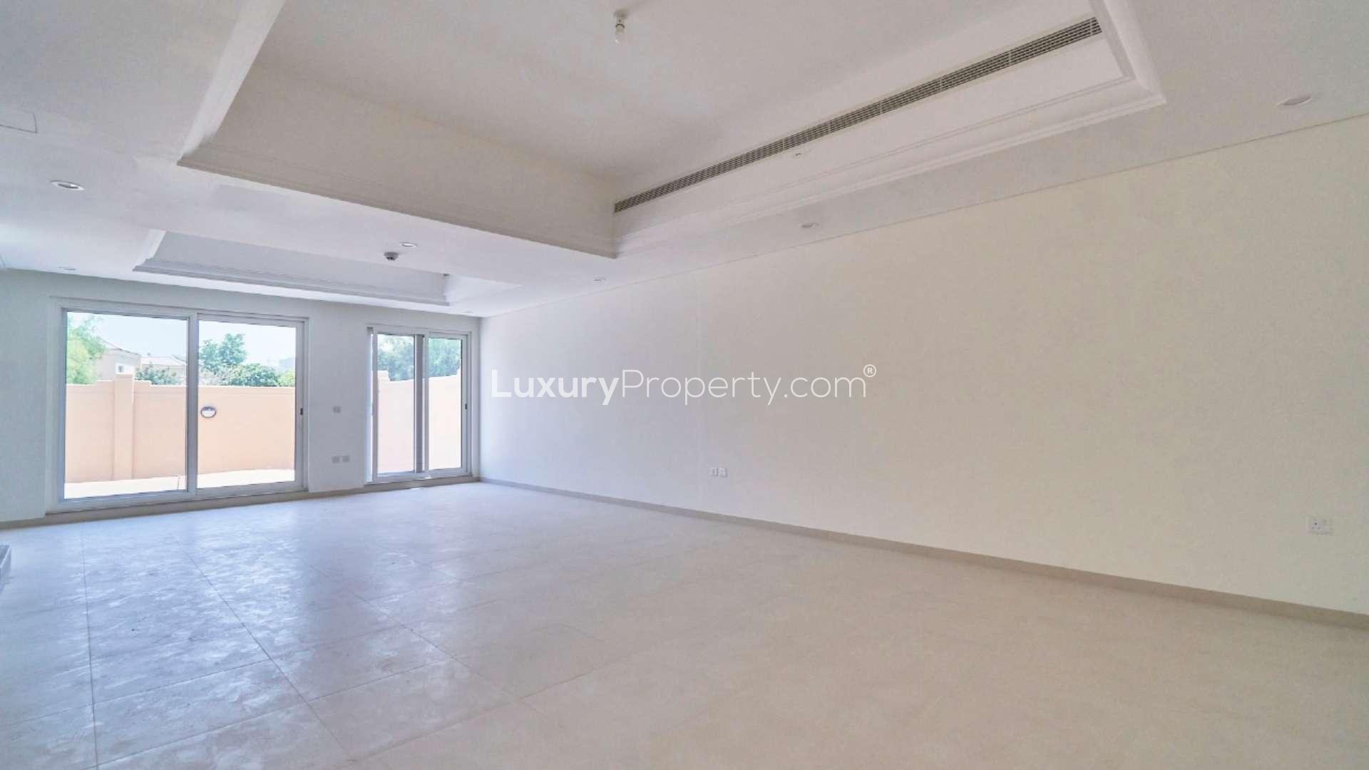 Empty bedroom with built-in wardrobes in Marbella Village townhouse, Victory Heights, Dubai