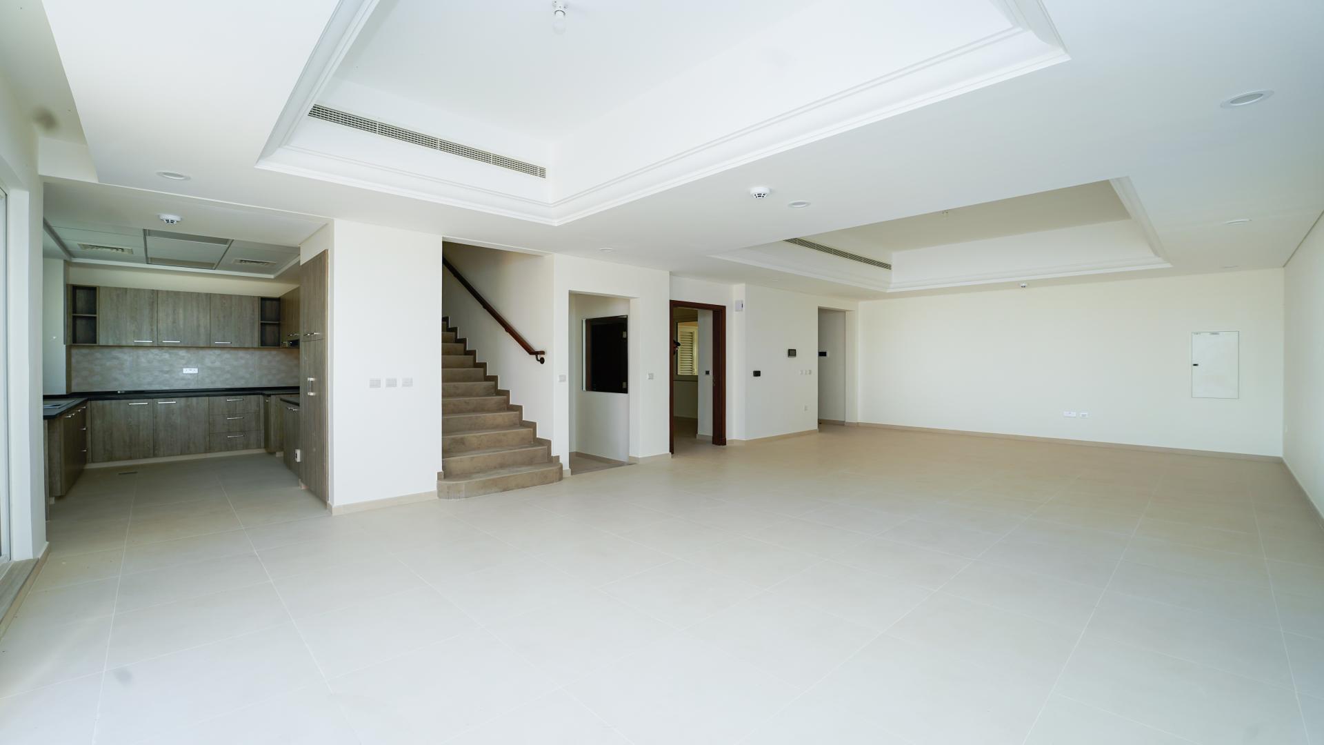 Exterior view of modern townhouse in Victory Heights, Dubai Sports City, for rent