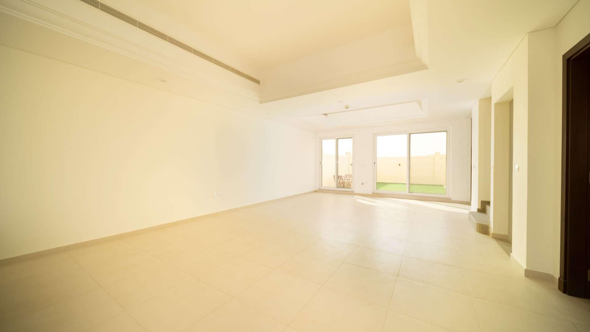 Community-facing villa patio with seating in Victory Heights, Dubai Sports City