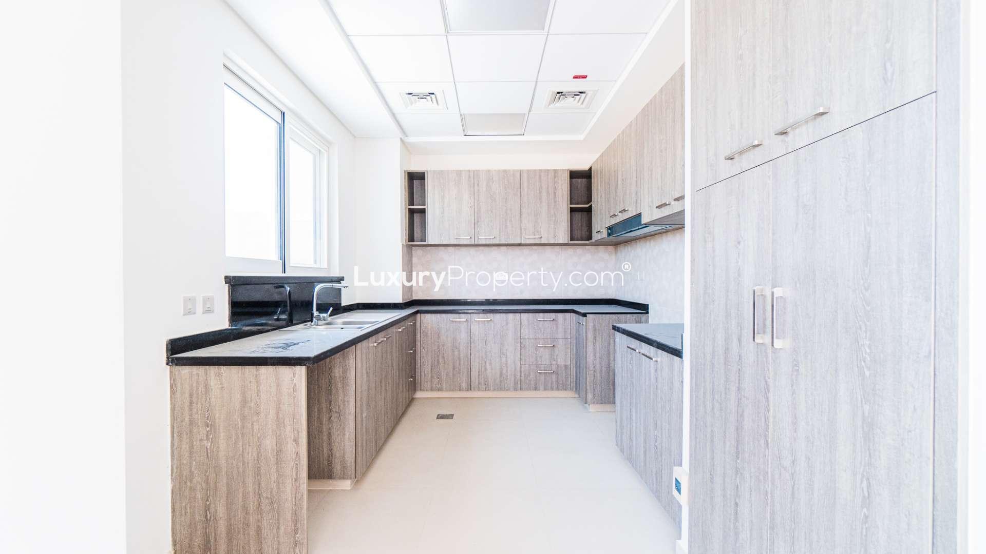 Modern living area in Victory Heights townhouse, Dubai Sports City, featuring elegant decor