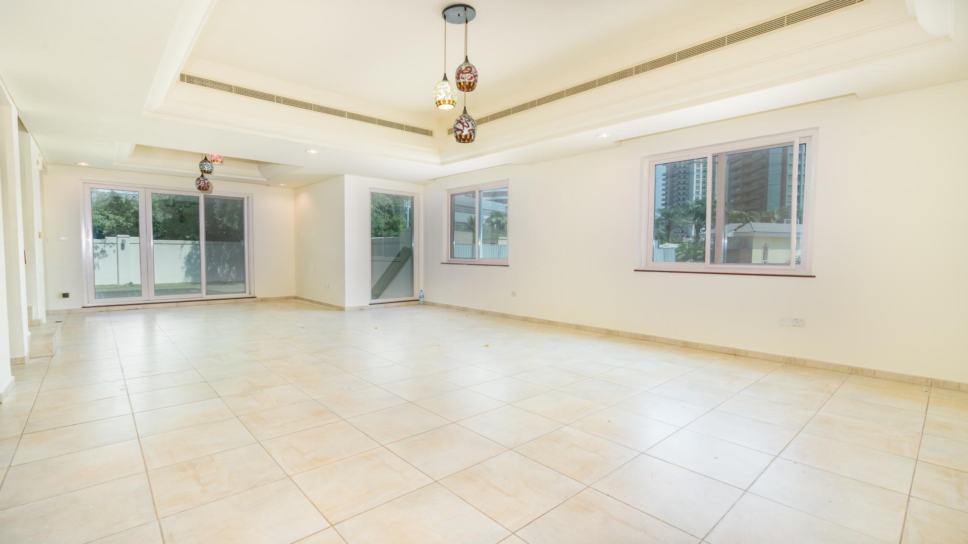 Townhouse exterior in Victory Heights, Dubai Sports City, featuring garage and modern architecture