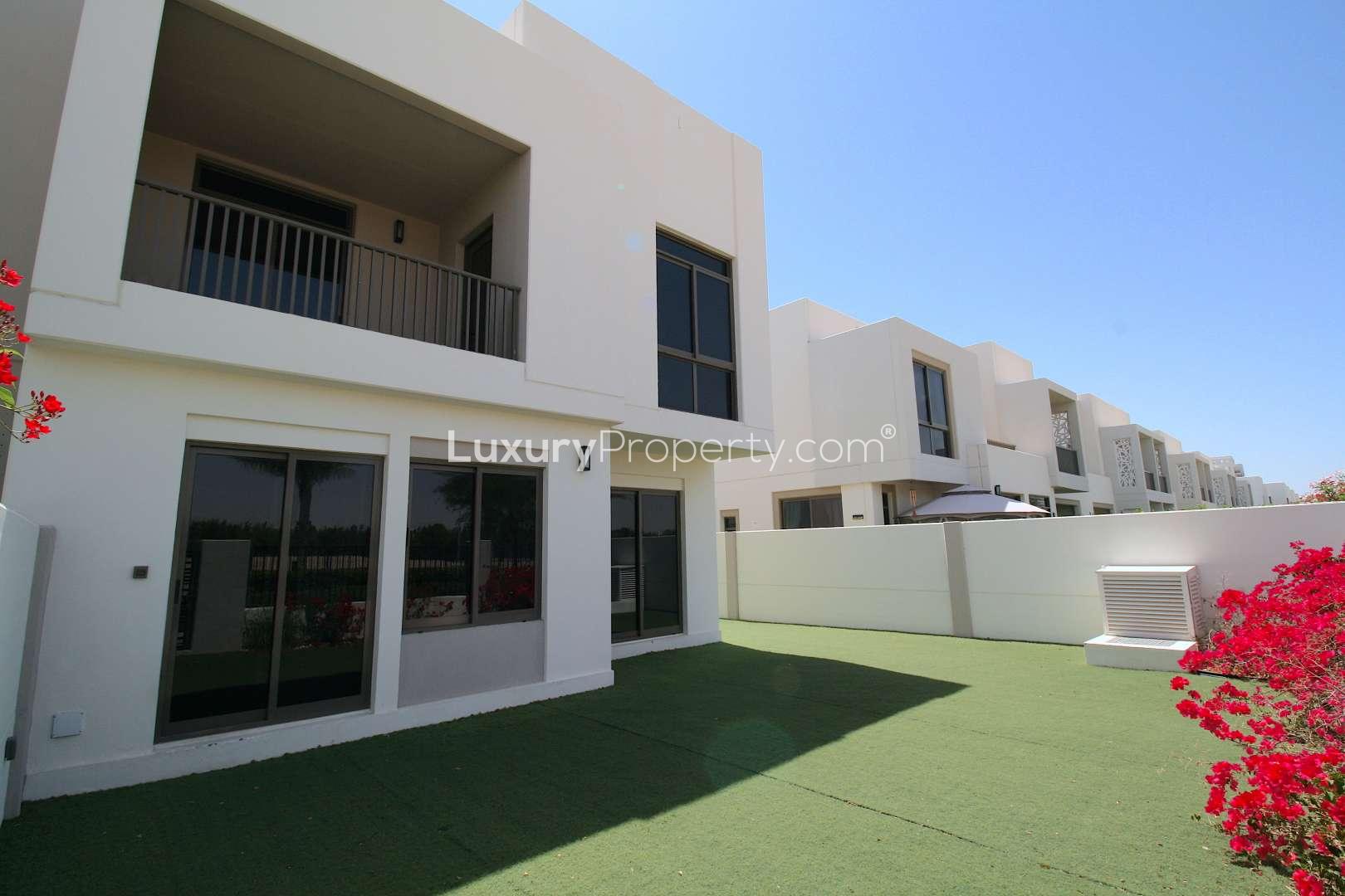 Spacious open-plan kitchen and living area in Zahra Townhouses, Town Square rental property