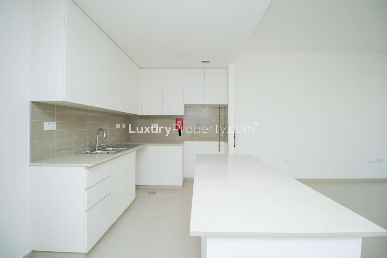 N/A,Modern kitchen in Zahra Townhouse, Town Square with sleek countertops and ample cabinetry