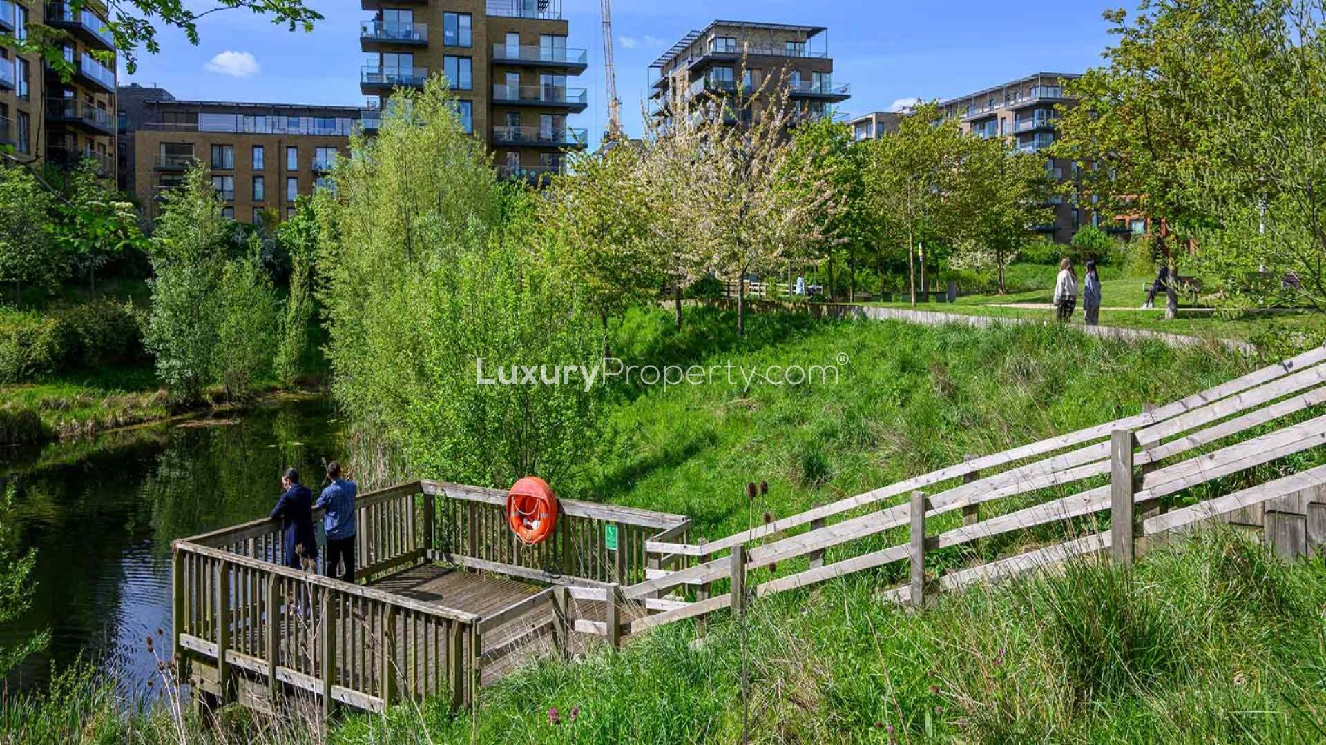 Luxurious bedroom in Kidbrooke Village townhouse, London, with modern decor and large window