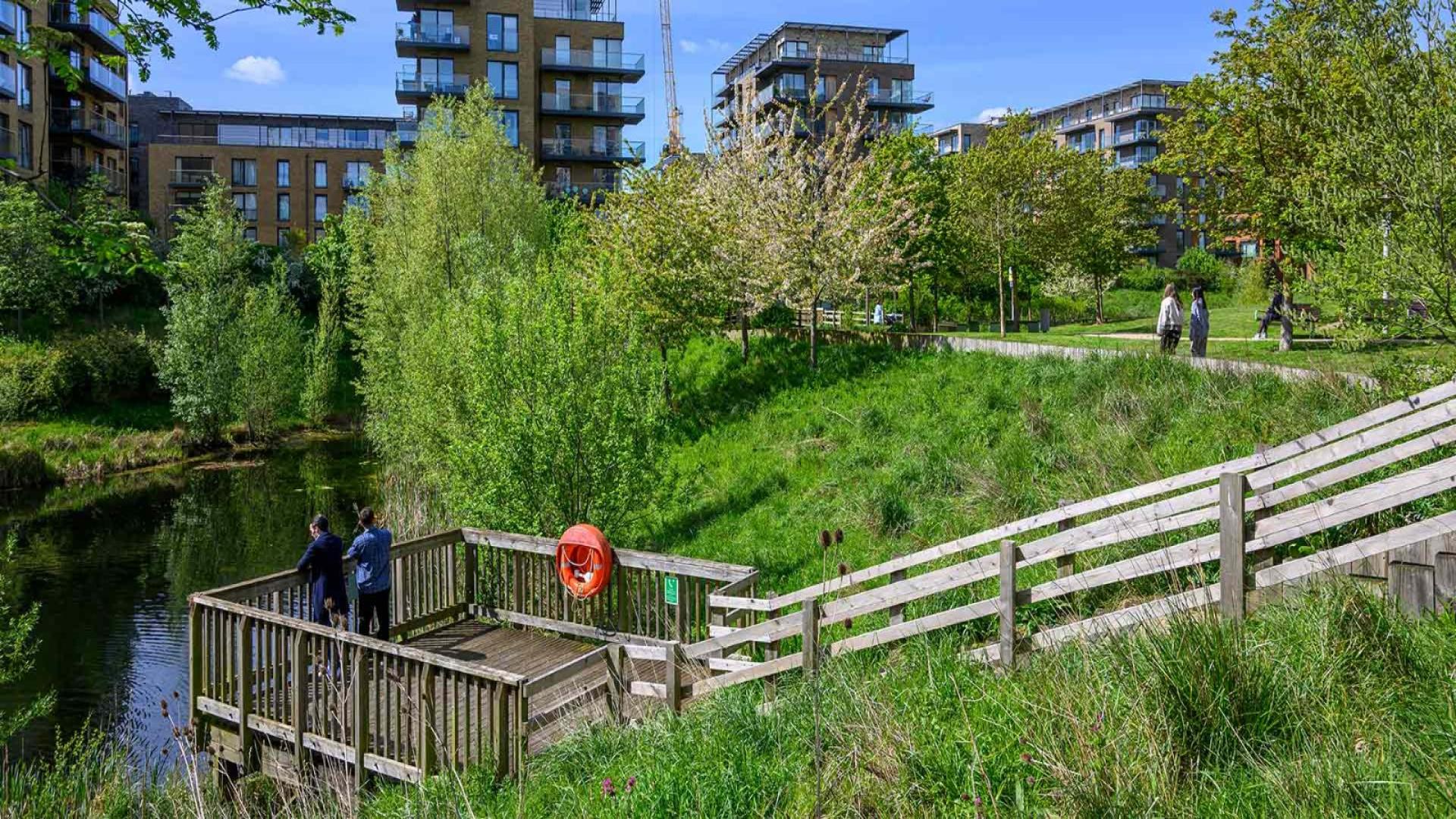 Luxurious bedroom in Kidbrooke Village townhouse, London, with modern decor and large window