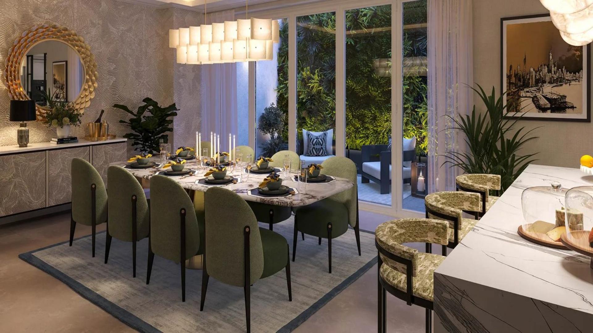 Modern kitchen in elegant four-bedroom townhouse, Fulham Beach, London. Marble island and stylish decor