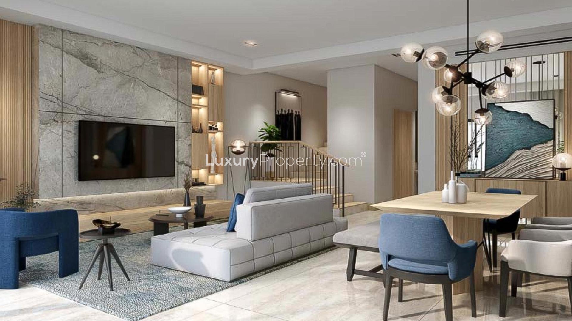 Modern living room in elegant 4BR townhouse, Damac Riverside, featuring stylish furniture and garden view