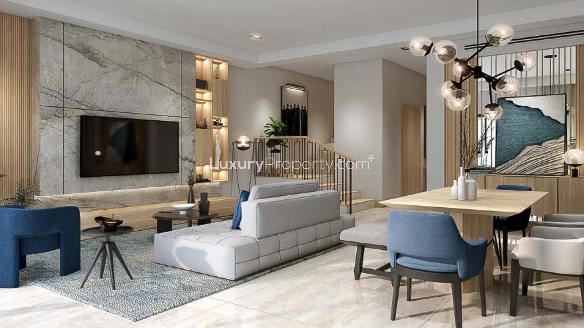 Modern living room in elegant 4BR townhouse, Damac Riverside, featuring stylish furniture and garden view