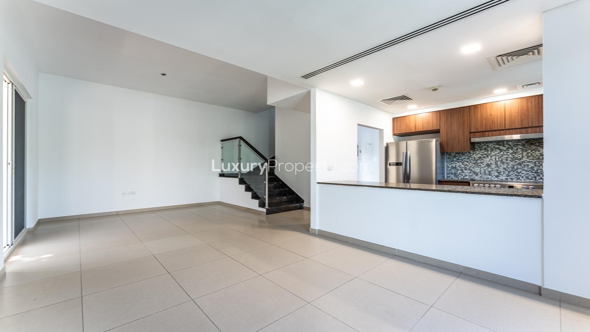 Modern kitchen and staircase in Arabella 3 townhouse, Mudon community, for sale