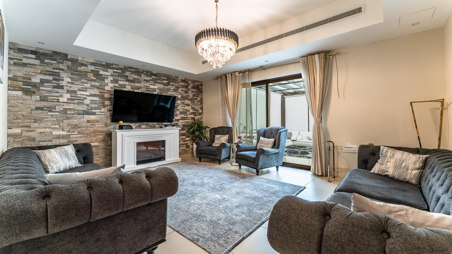 Entrance of modern townhouse in Mira 2, Reem community, featuring elegant interior design