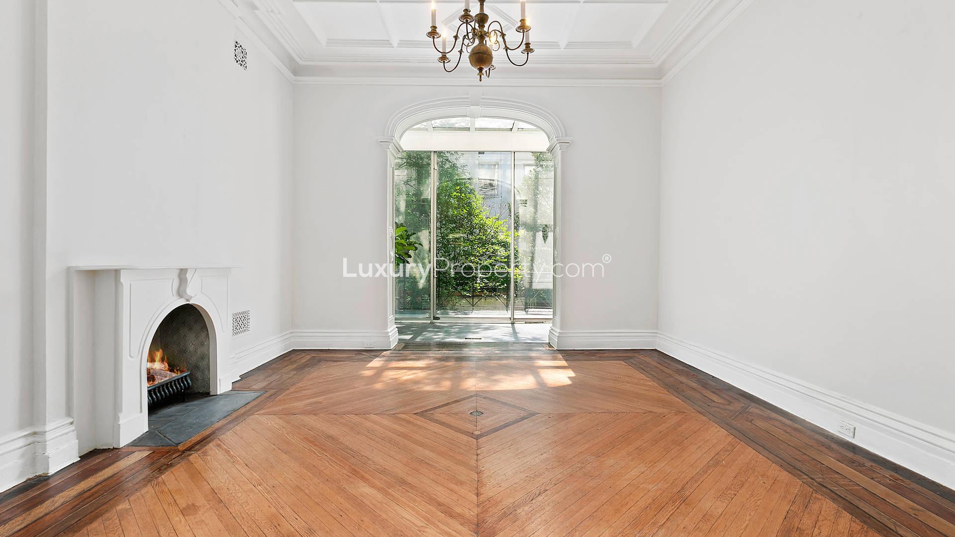 Elegant living room with fireplace in Manhattan townhouse, 172 East 71st Street, for sale