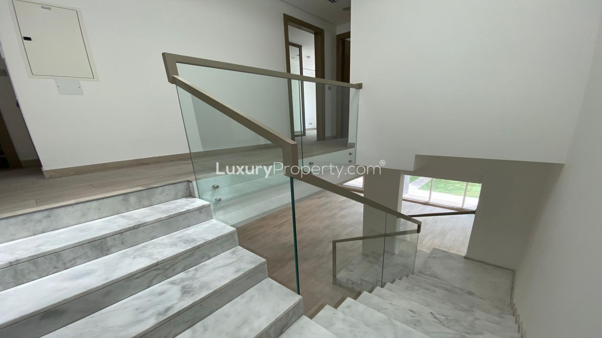 Open-plan living area with modern staircase in Jumeirah Park townhouse, Royal Park community