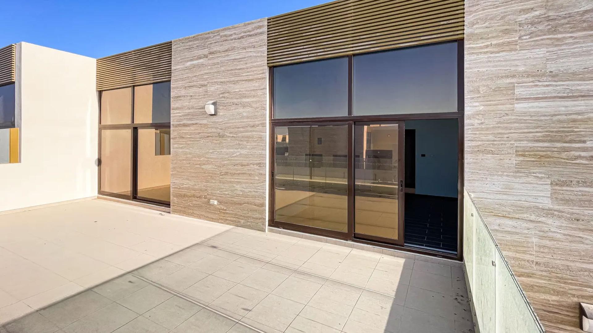 Modern Elie Saab townhouse exterior with large windows, Meydan community, Dubai. For sale