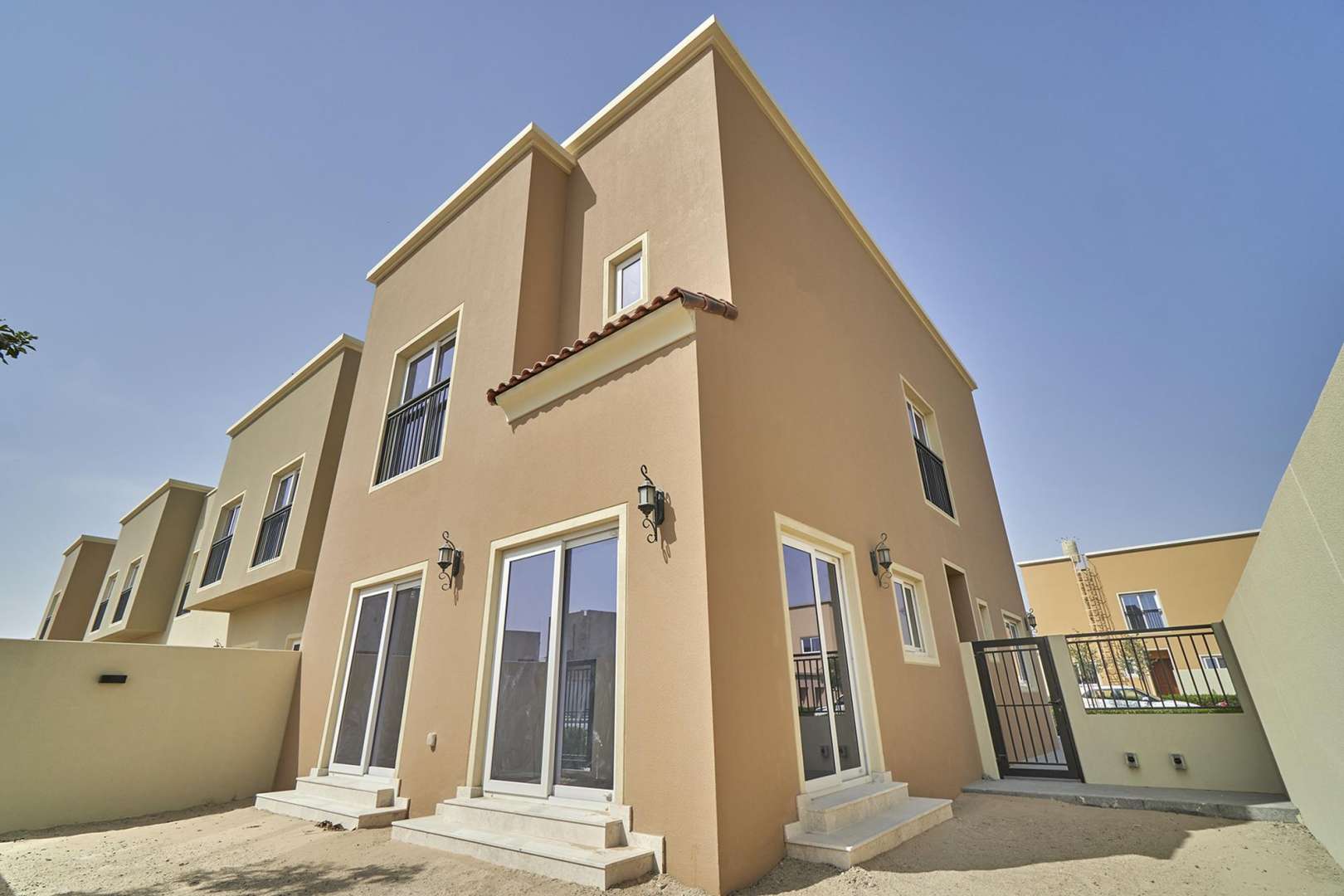 4-bedroom corner townhouse exterior with driveway and garden in Villanova, Amaranta for sale
