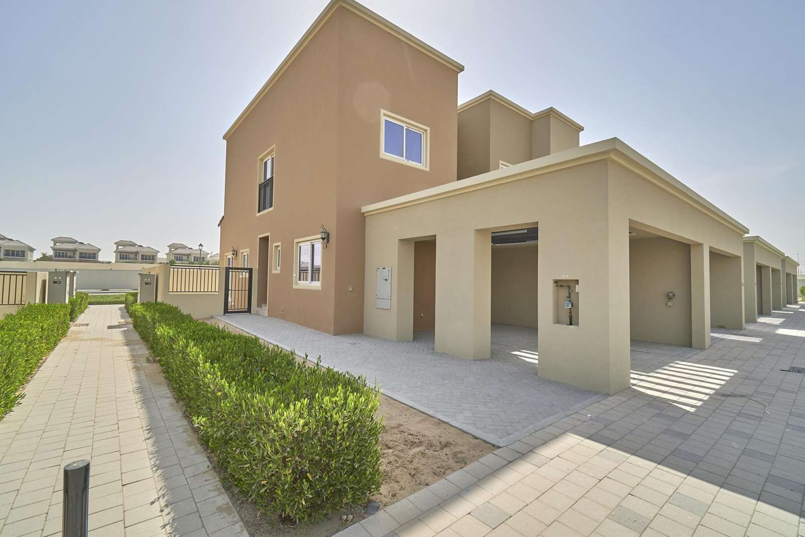 Brand-new townhouse interior with modern kitchen and staircase in Villanova, Dubai Land