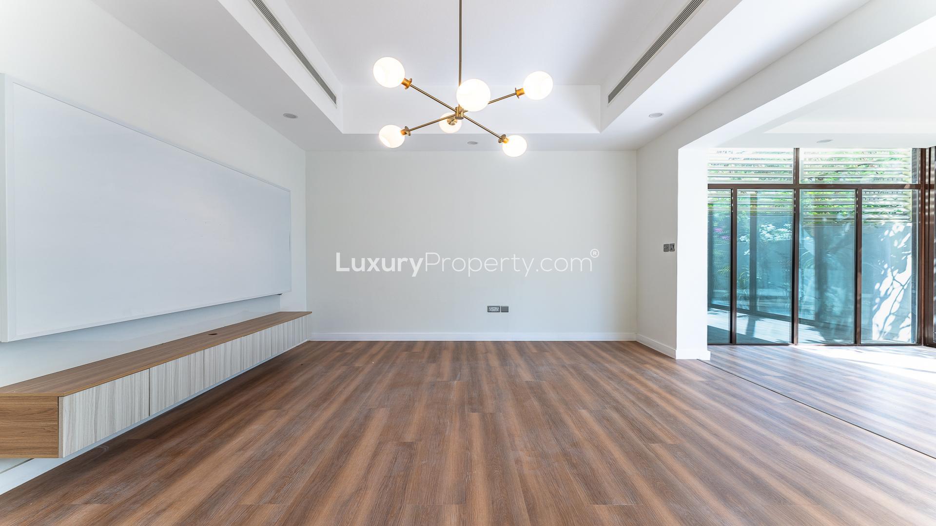 Modern living area in Reem Mira townhouse for sale, spacious and well-lit interior design
