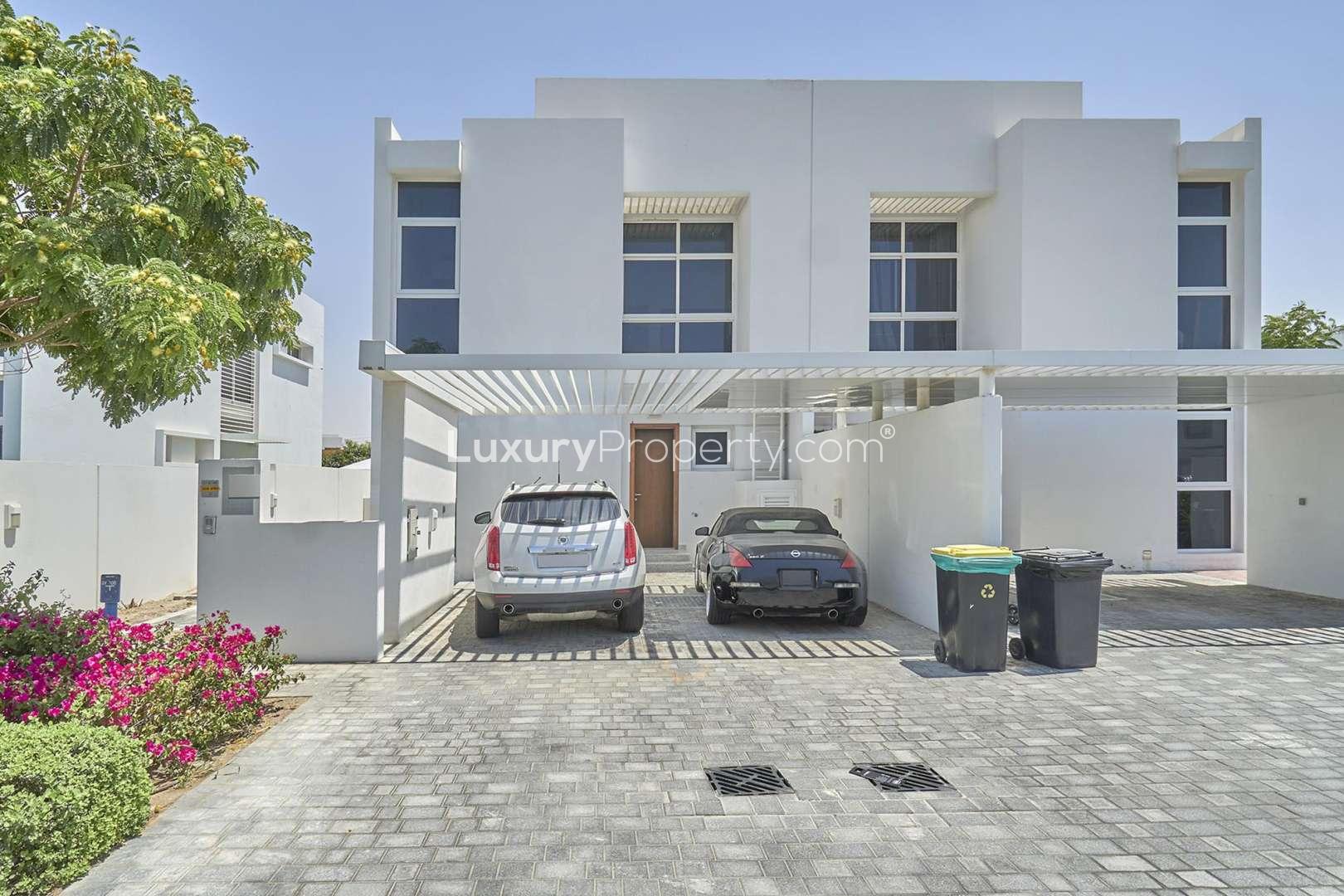 Bright empty room with large window in Arabella Townhouses, Mudon community