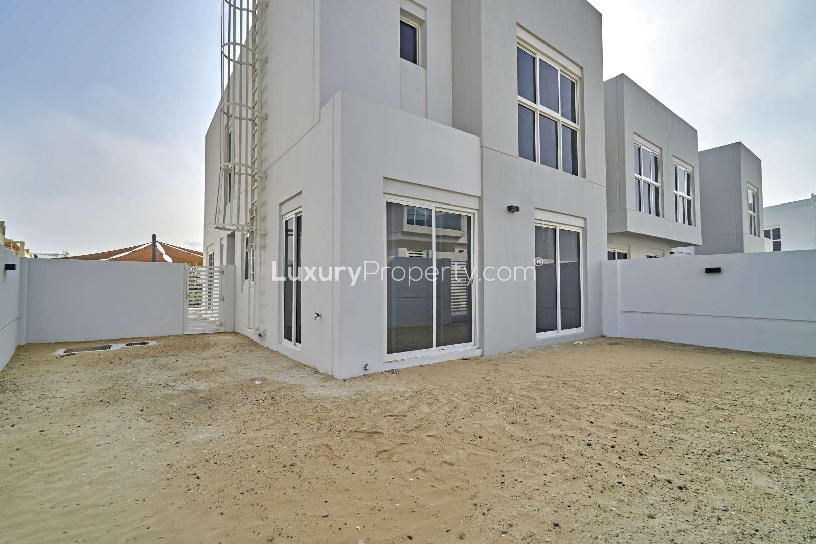 Exterior view of Mudon Arabella townhouse with spacious backyard for sale