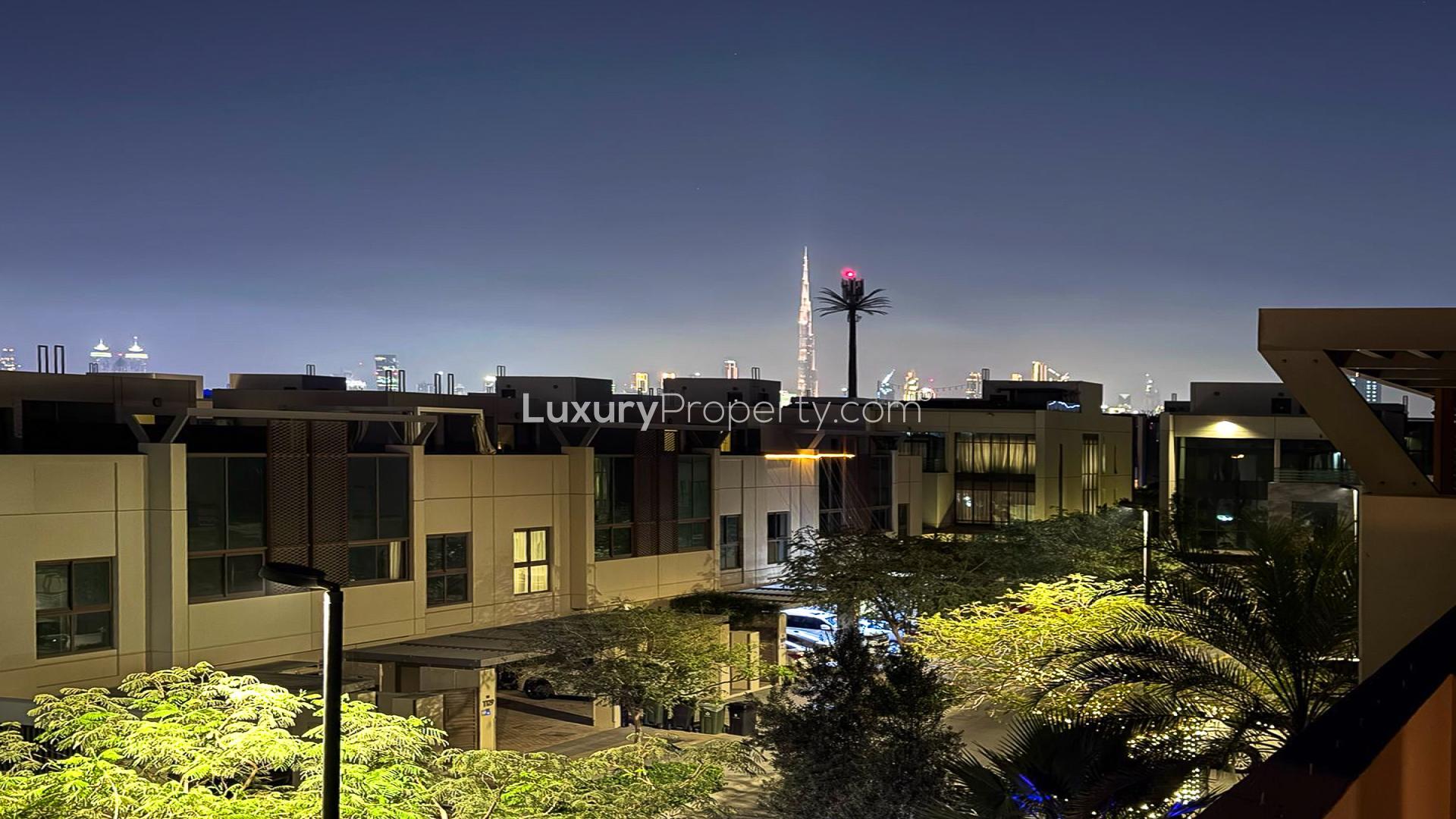 Spacious living room with large windows in Meydan townhouse, Grand Views community