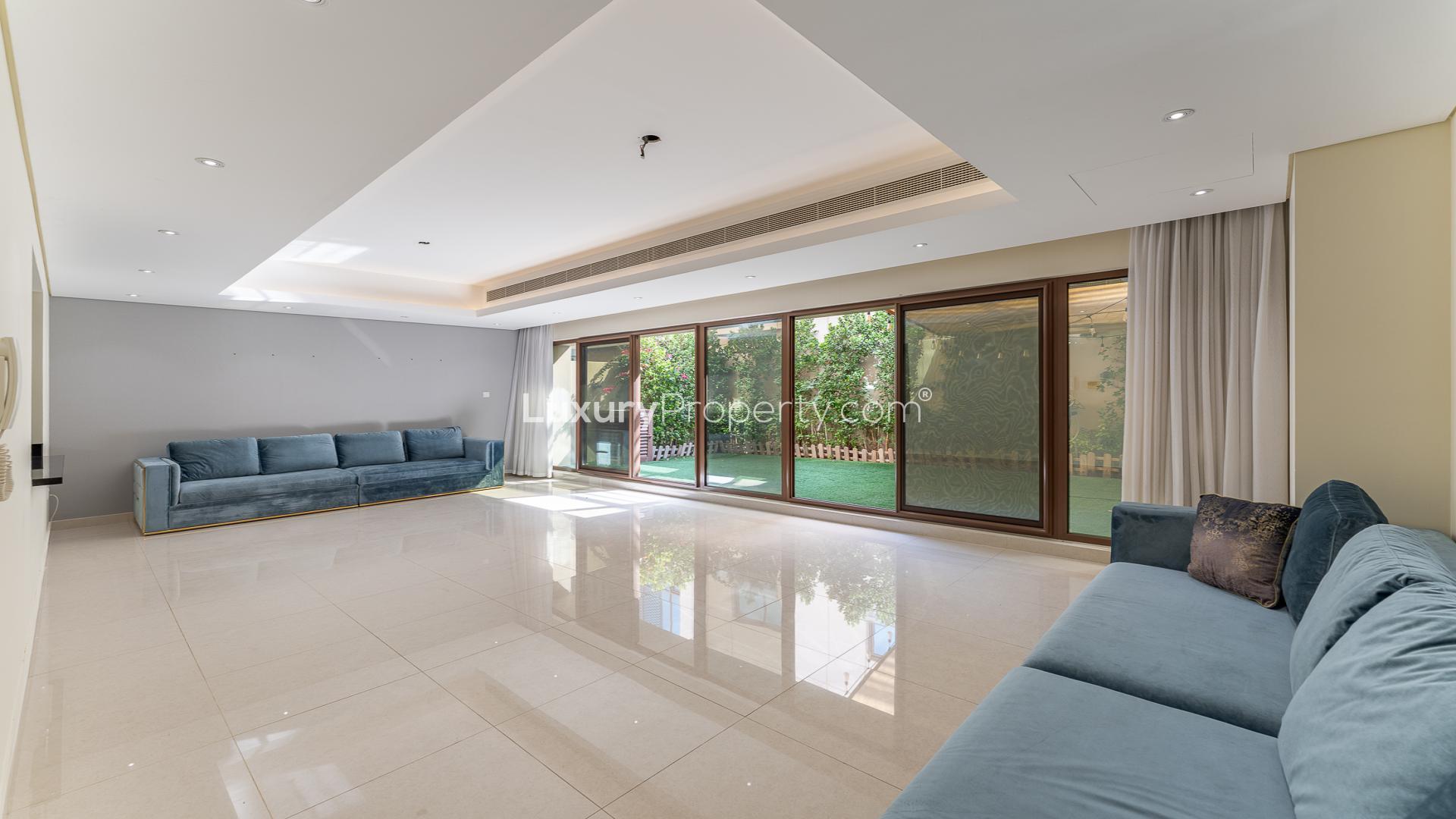 Townhouse exterior in Meydan's Grand Views community, showcasing modern architecture and spacious driveway