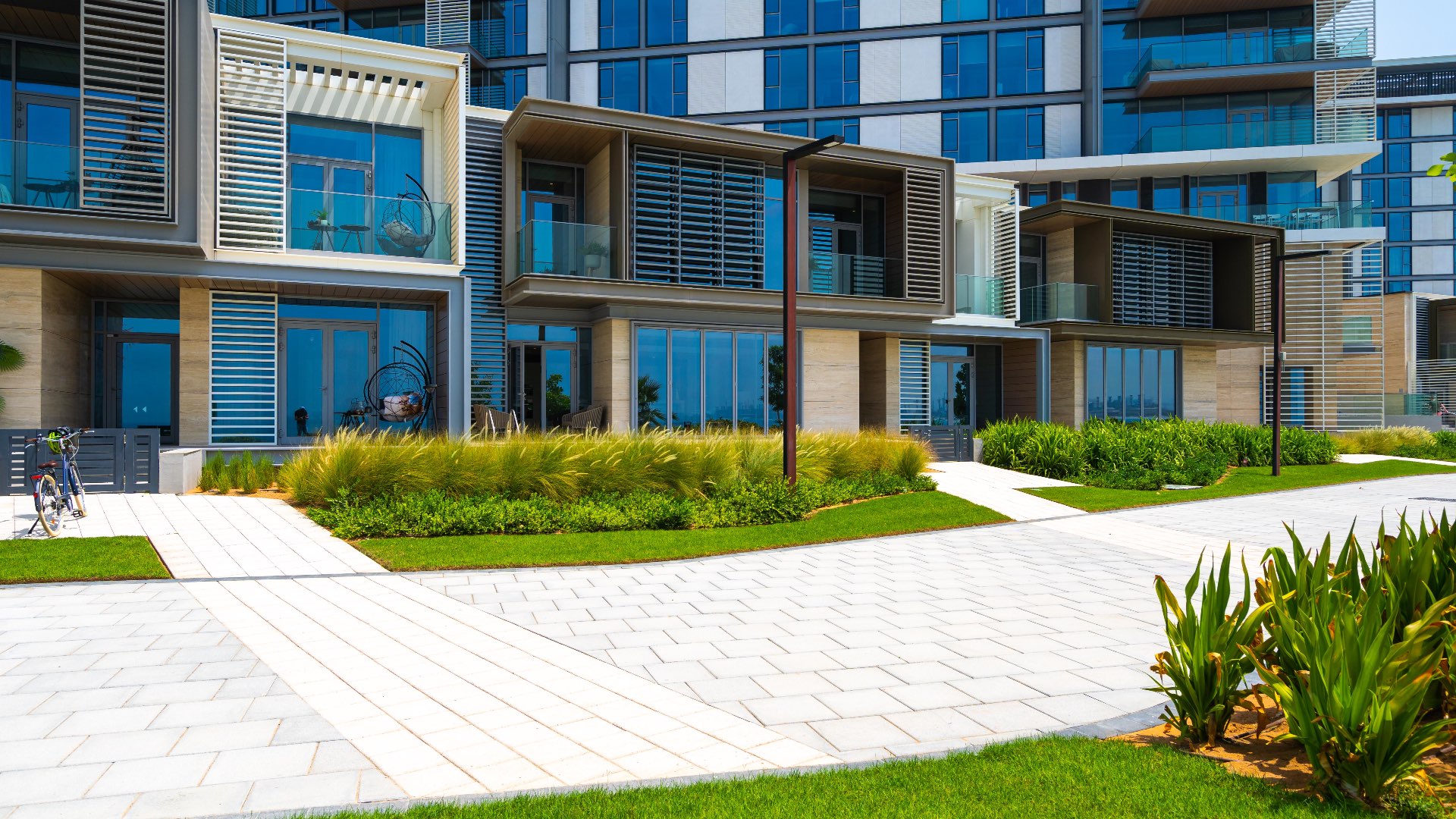 Modern bathroom with dual sinks and bathtub in Bluewaters townhouse for sale