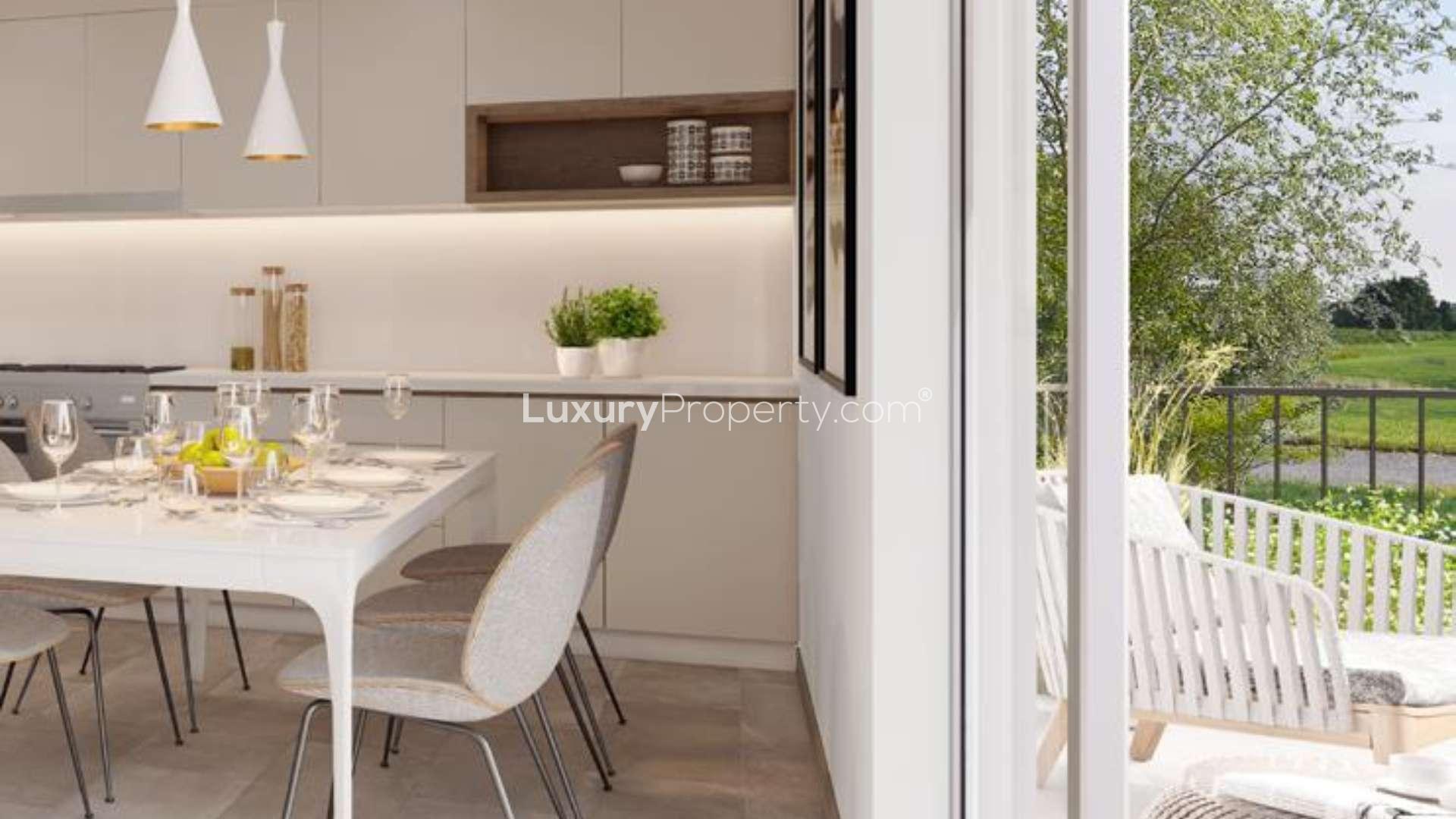 Modern three-bedroom townhouse in Camelia, Arabian Ranches 2, featuring sleek design and carport