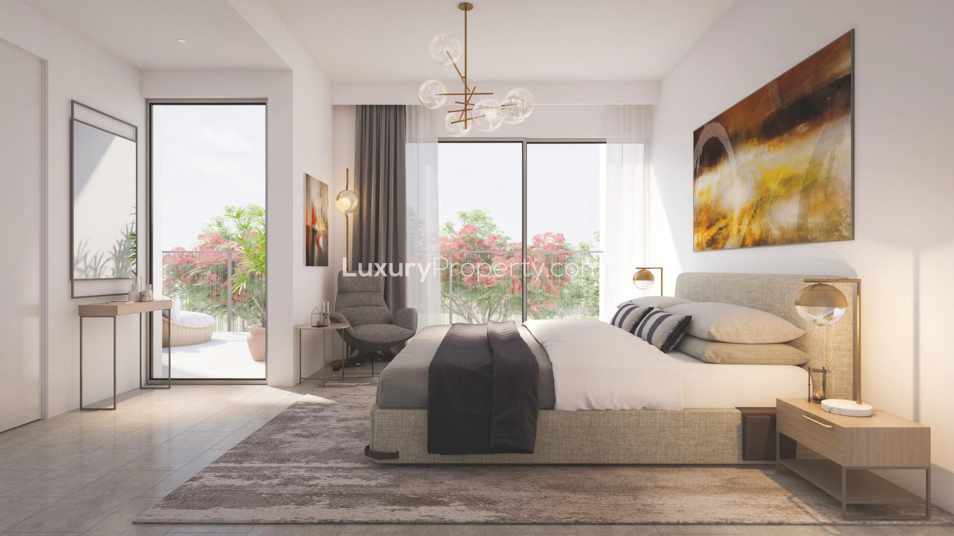 Modern townhouse community in Tilal Al Ghaf, Dubai, with vibrant playground and lush greenery