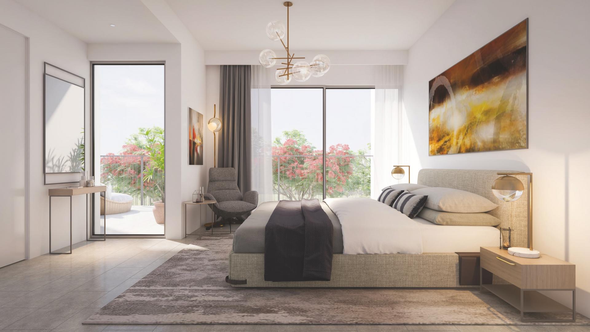 Modern townhouse community in Tilal Al Ghaf, Dubai, with vibrant playground and lush greenery