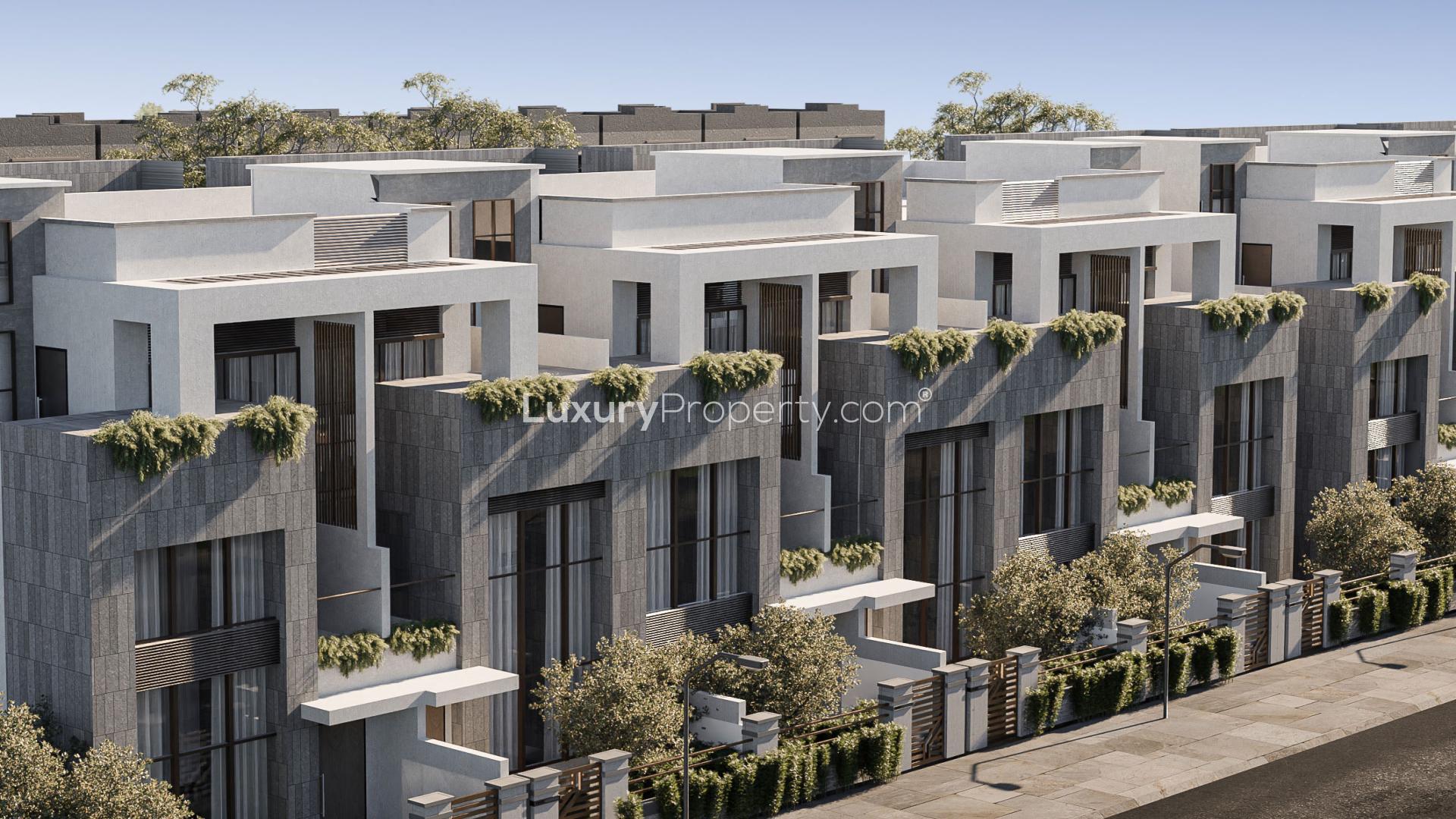 Modern living room in Marwa Homes 4 townhouse, Jumeirah Village Circle. Sleek design with marble accents