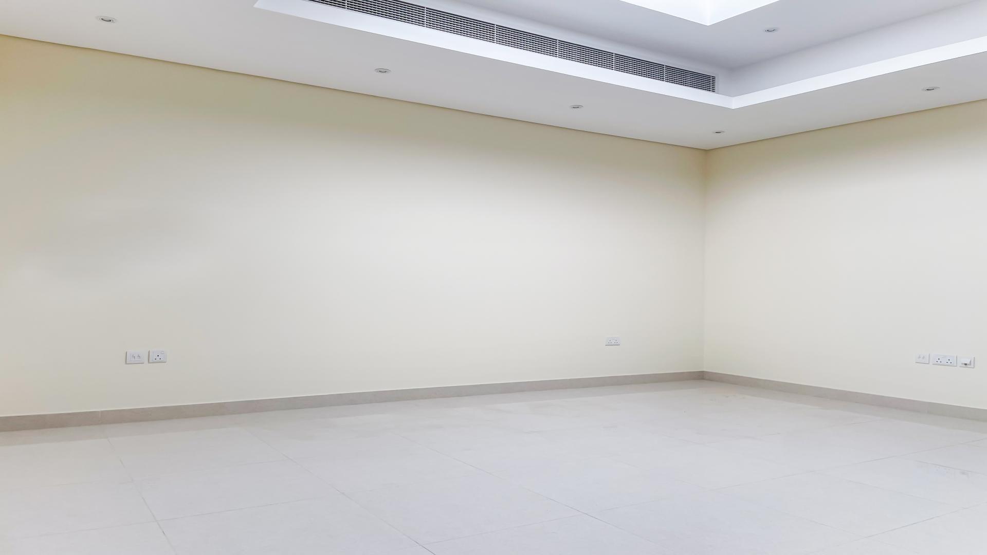 Spacious living room in Meydan townhouse, modern lighting, open layout, large windows