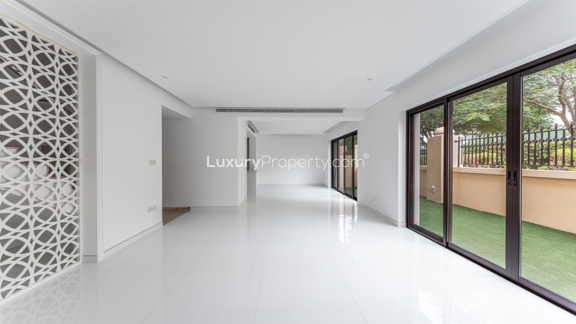 Rooftop view of townhouse in Bloomingdale, Dubai Sports City, overlooking modern high-rise buildings