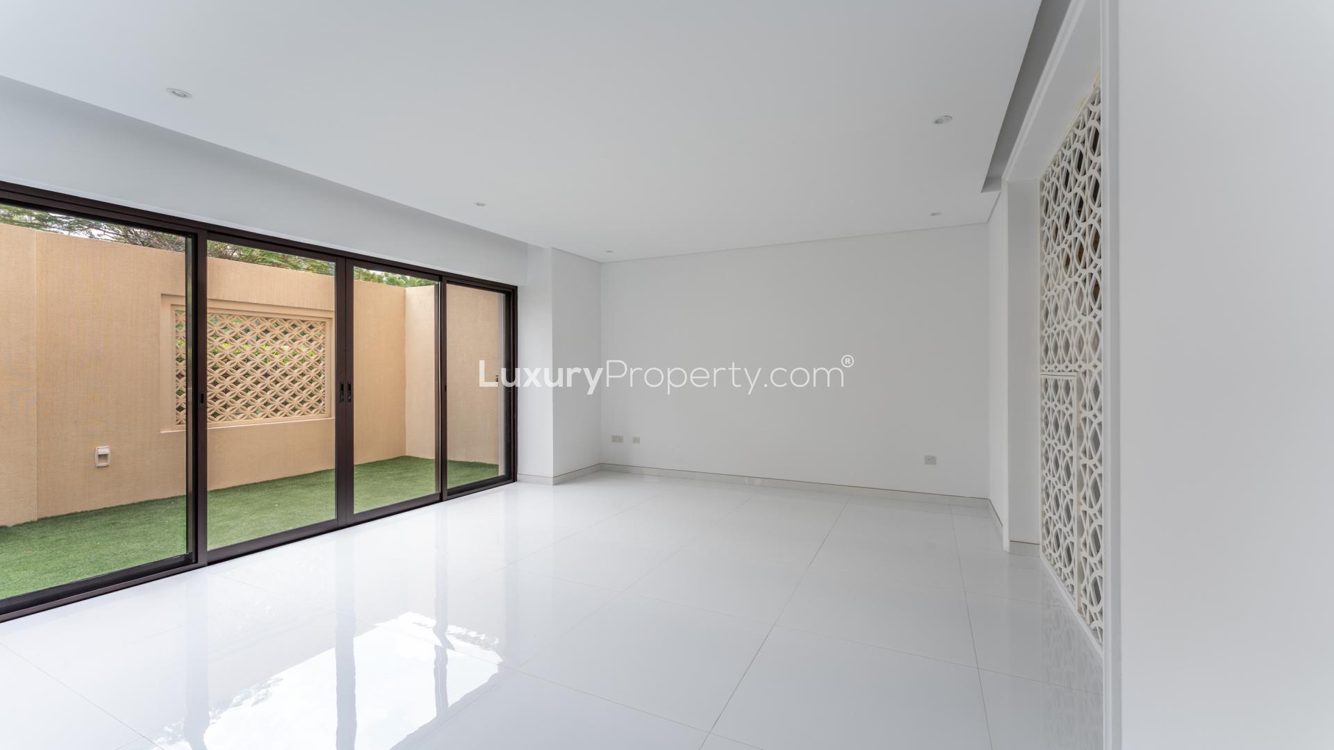 Spacious modern kitchen and living area in Bloomingdale townhouse, Dubai Sports City