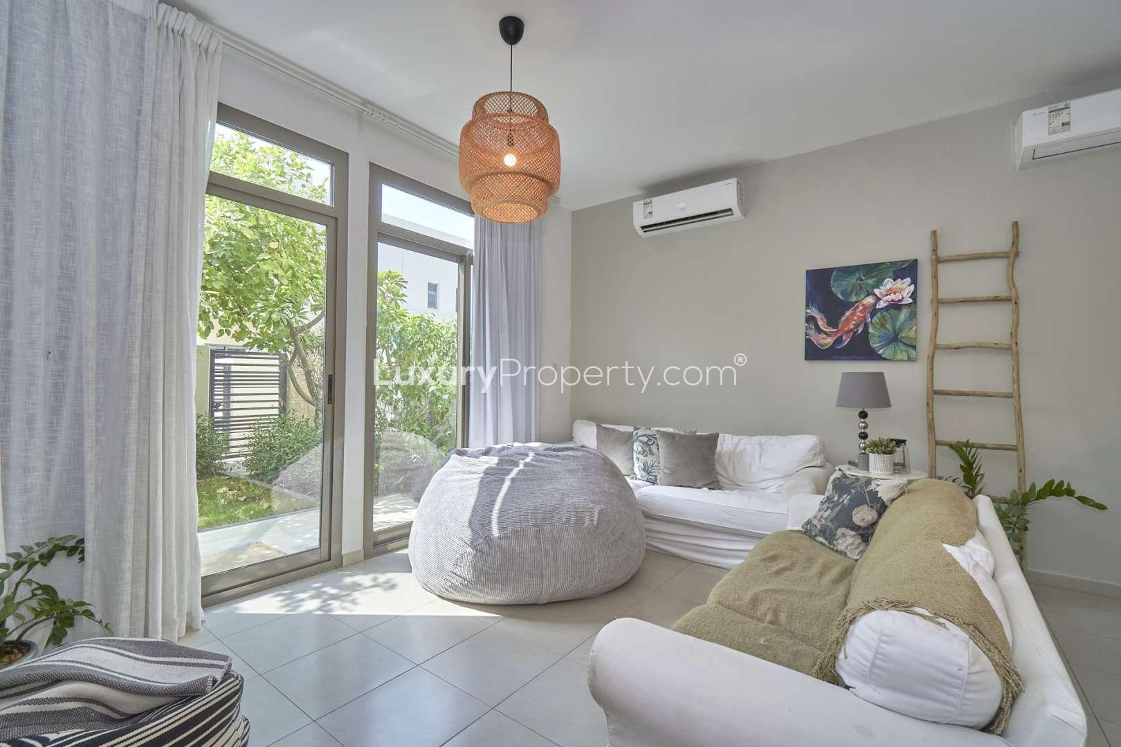 Front view of a modern 4-bedroom villa in Hayat Townhouses, Town Square for sale