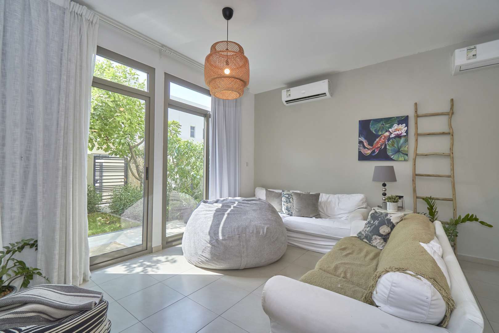 Front view of a modern 4-bedroom villa in Hayat Townhouses, Town Square for sale