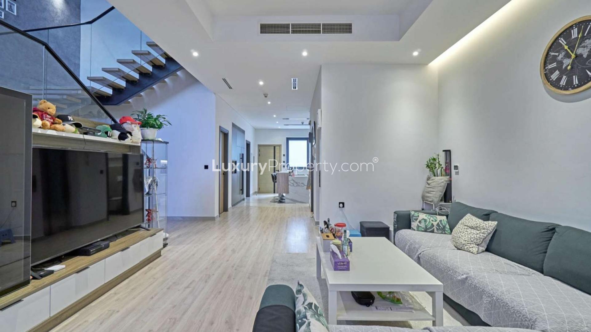 Modern living room with staircase in Hyati Avenue townhouse, Jumeirah Village Circle