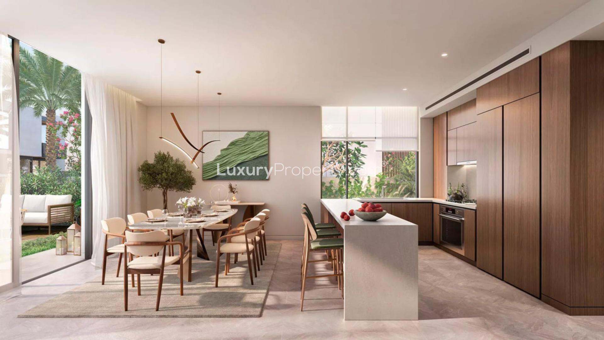 Modern dining room in Dubai Land townhouse, featuring elegant decor and large windows