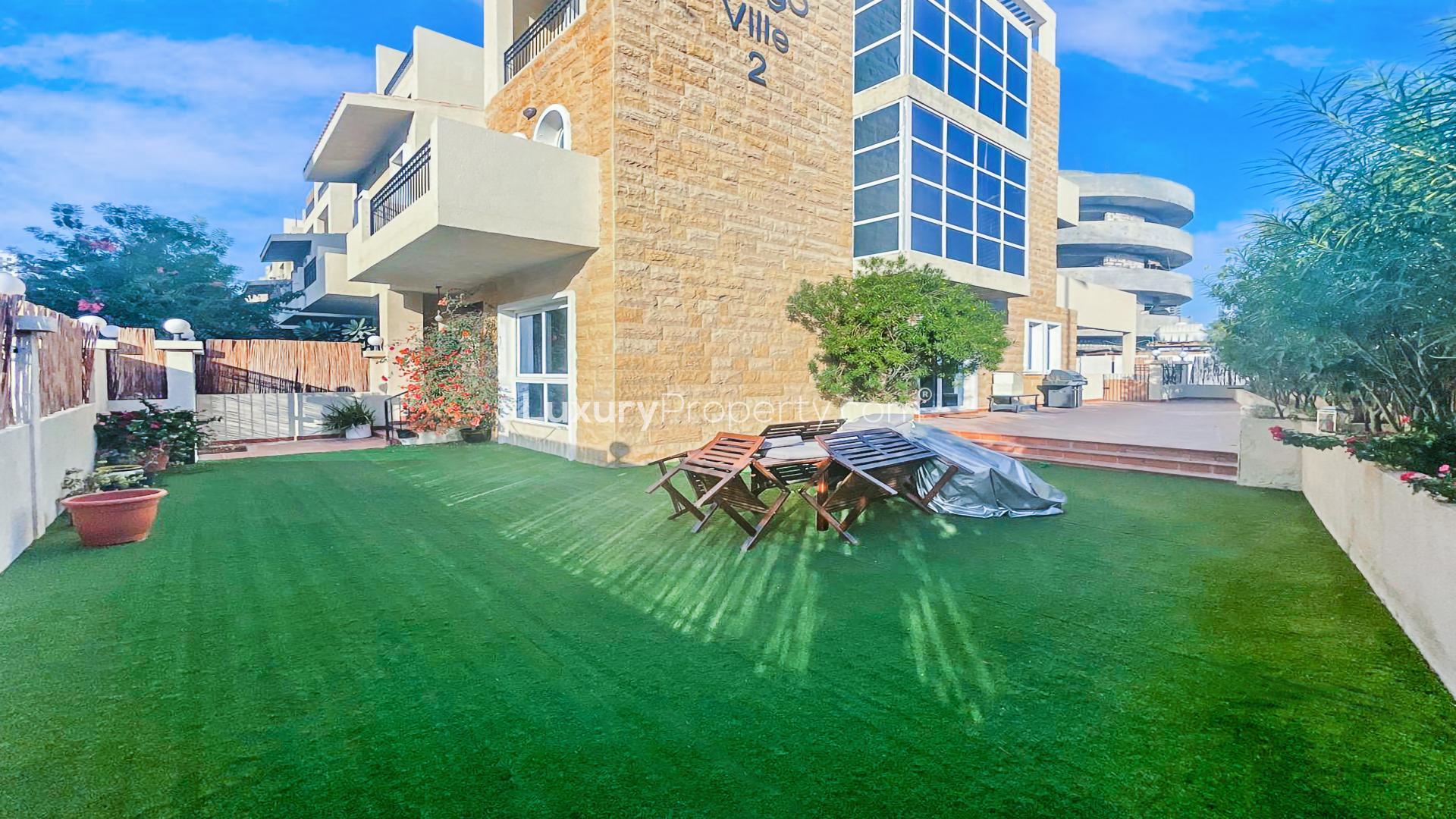 Modern kitchen and dining area in 4-bedroom villa, Jumeirah Village Circle townhouse