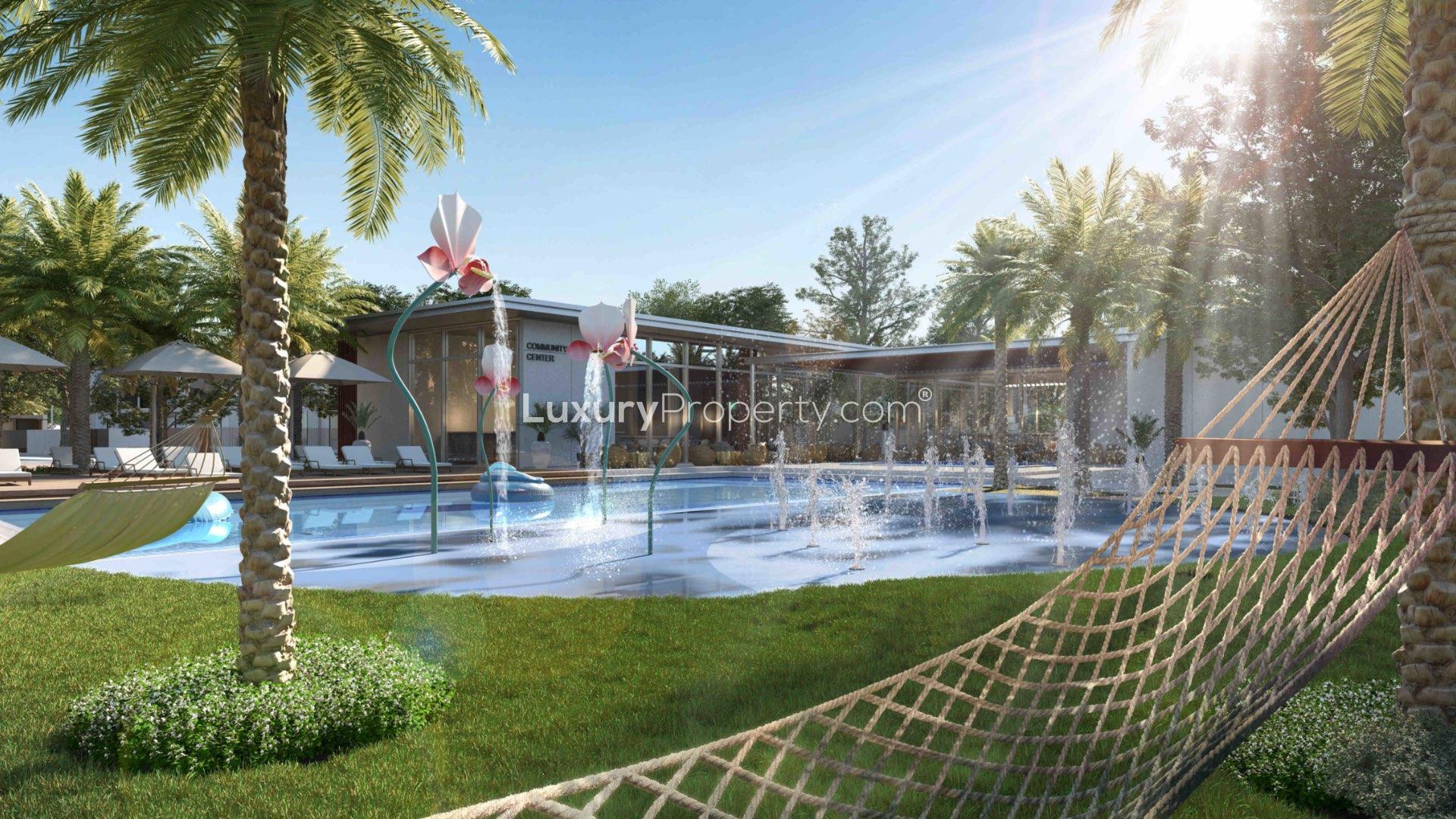 End-unit townhouse dining and living area in Arabian Ranches III, Joy community