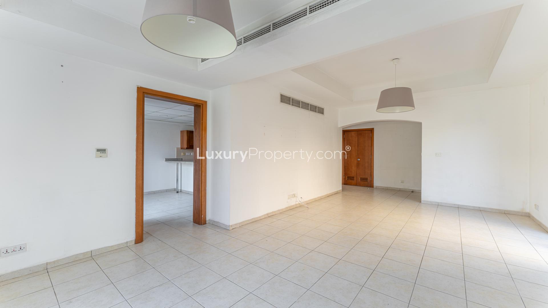 Balcony view of lush garden and neighboring villas in Al Reem 1, Arabian Ranches