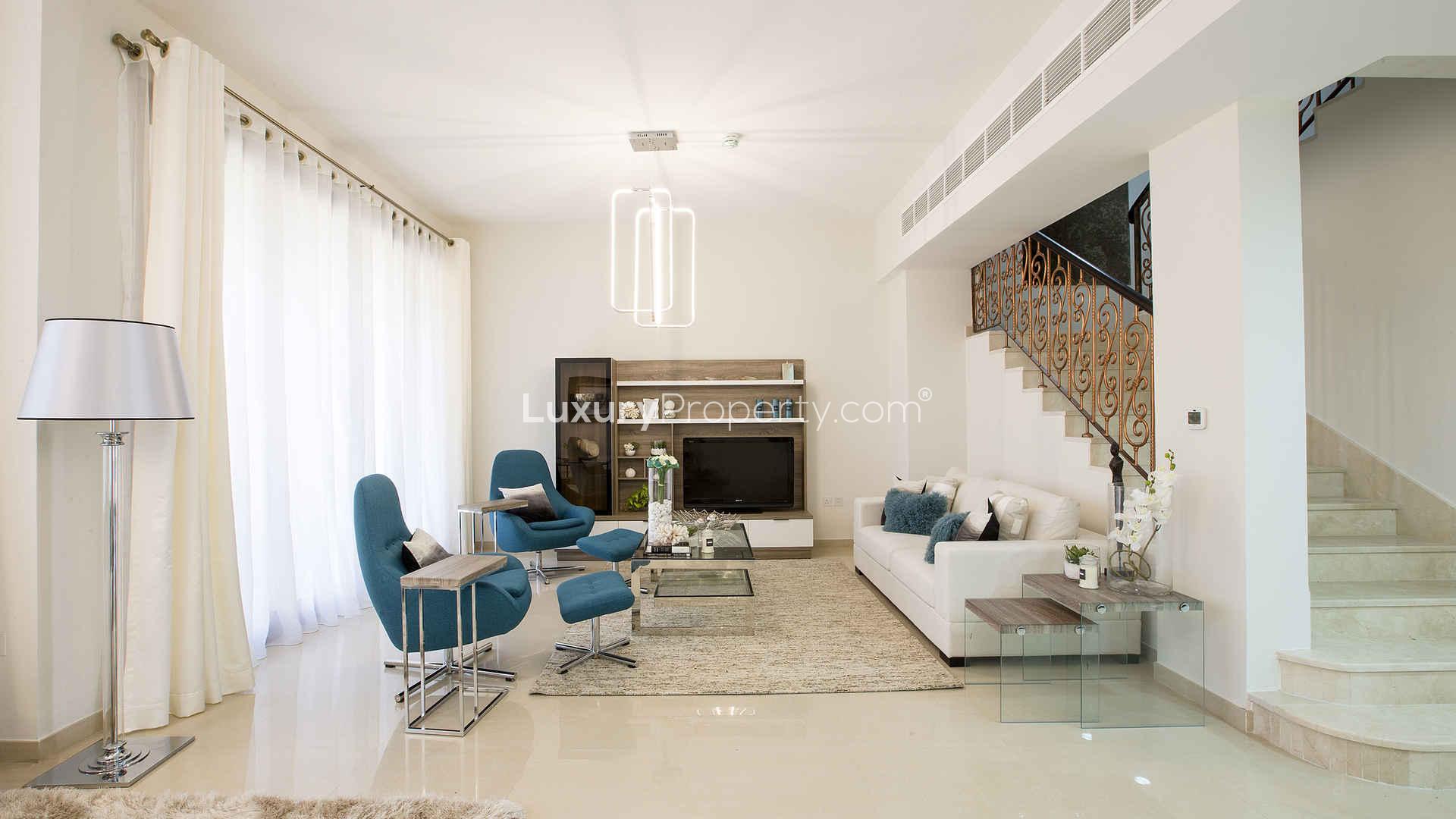 Elegant open-plan living and dining area in Jumeirah Islands townhouse for sale